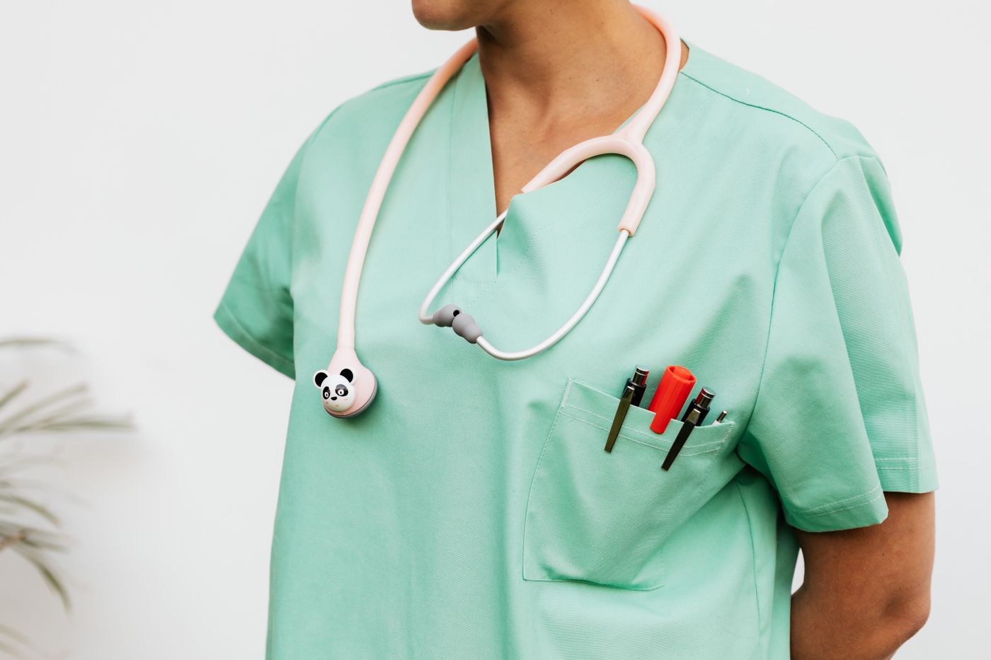 A nurse in scrubs with a stethoscope